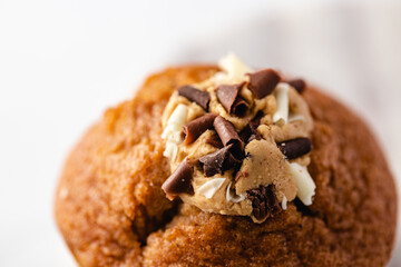 Chocolate muffin on a white plate - light colour palette