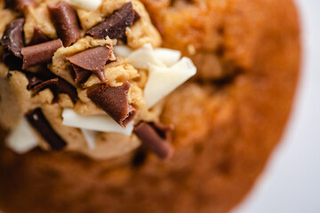 Chocolate muffin on a white plate - light colour palette