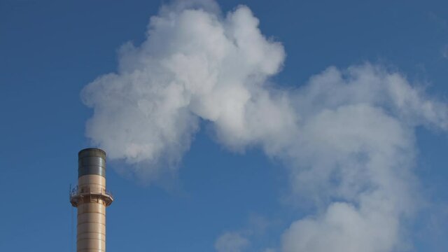 fluffy white smoke on factory industrial chimney heating coal power Plant blue sky air pollution wide shoot 3