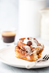 Cinnamon rolls having been baked - with cream cheese frosting