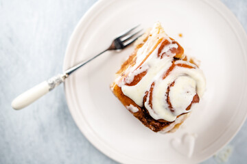 Cinnamon rolls having been baked - with cream cheese frosting