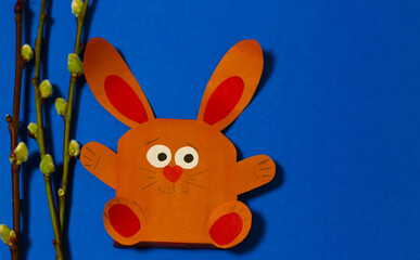A rabbit made of paper on a blue background. Branches of the Tree of Verba, 