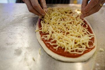 Fresh flatbread pizza topped with pepperoni cheese and tomato sauce