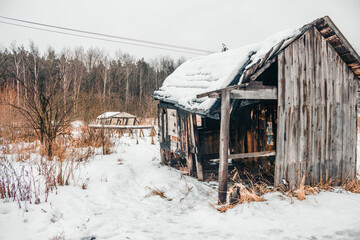 Wooden house that burned down for half on cold winter day