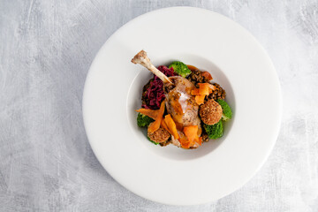 Confit duck leg with seasonal vegetables