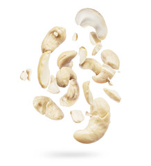 Cashew nuts crushed into many pieces close-up, isolated on white background
