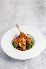 Confit duck leg with seasonal vegetables