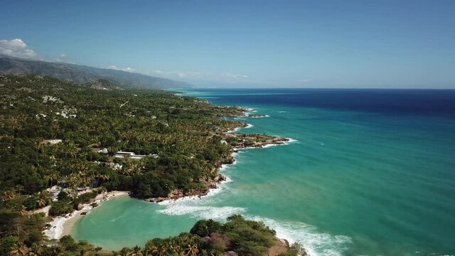 Aerial Flying Forward Over Turquoise Water Along Haiti Coast