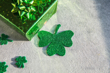 Happy st. Patrick's day. Card with  lucky clover, green gift box. Irish festival symbol. Lucky concept. St. Patrick's day background with gift. Copy space.