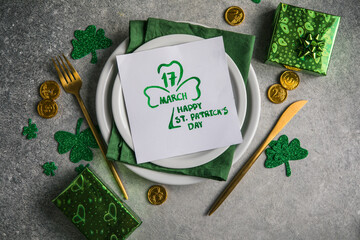 Beautiful festive table setting for St.Patricks day with cutlery and lucky symbols. Copy spase in...