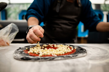 Charcoal pizza base with pepperoni