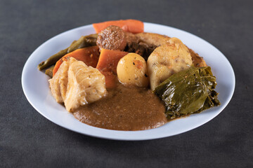 Cozido is a dish of Brazilian food on gray background.