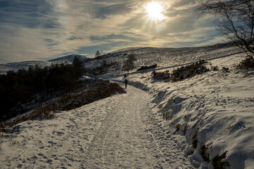 Walker on the Malvern Hills in snowy weather Worcestershire UK