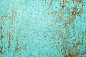 Wood texture painted with blue paint, old scratches on the surface
