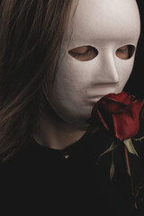 a romantic woman in a white mask