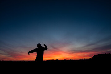 silhouette of a person - obrazy, fototapety, plakaty