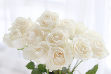 Fresh white roses, wedding, and holiday arrangements. Valentine`s Day and holiday background.