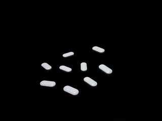 Antidepressants drug pills on black background