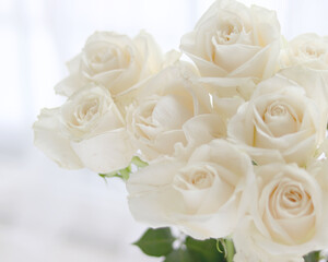 Fresh white roses, wedding, and holiday arrangements. Valentine`s Day and holiday background.