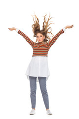 Full length portrait of beautiful stylish girl in fashion blue jeans and striped jumper with long curly hair posing - isolated on white background. Fashion model posing at studio.