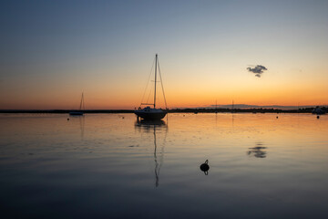 Fototapeta na wymiar Reflections of the Sunset at Old Leigh, Leigh-on-Sea, Essex, England