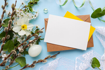 Easter card mockup. spring flowers, easter eggs, willow twigs and space for text 