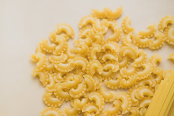 pasta on a beige background. Flat lay. copy space.