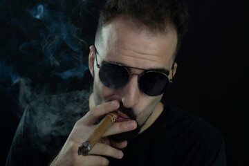 man smoking cigarette