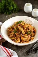 Turkey stew with buckwheat, onion, zucchini and carrots. 