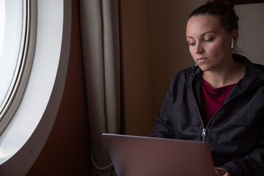 A young woman working remotely