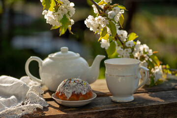 Tea set and cherry blossom on wooden table