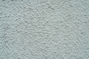 Light plastered wall with defects texture close up