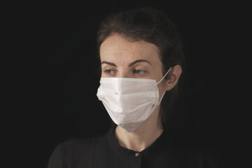 a woman wearing a coronavirus mask.