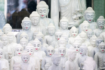 Various Buddha statues on display in shop, Mandalay, Myanmar