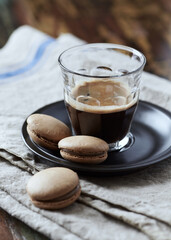 Coffee in glass cup on rustic wooden background. Close up.	