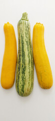 Two yellow and one green courgettes, pumpkin, São Paulo, Brazil
