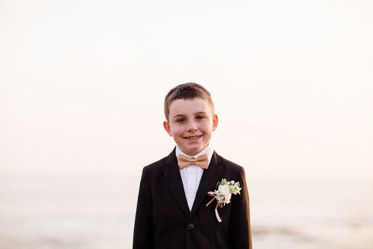 Close Up of Nine Year Old Boy in Tux on Beach in San Diego