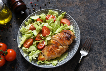 Baked chicken breast with honey and salad with cabbage and tomatoes. Healthy food, keto diet, paleo diet. Top view with copy space.