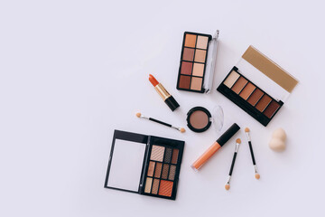 Makeup products on light background. Top view