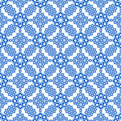 Seamless pattern of curly stars in blue shades. Intricate oriental print on a white background.