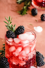 blackberry whiskey cocktail with rosemary garnish