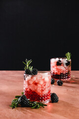 blackberry whiskey cocktail with rosemary garnish