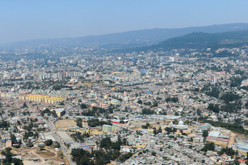 Aerial overview of Addis Abeba city, the capital of Ethiopia. Multiple houses and buildings visible at Addis Ababa.
