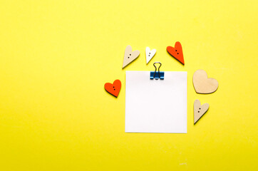Valentines day and for love stories.Little red, white hearts. Yellow background with red hearts and place for text