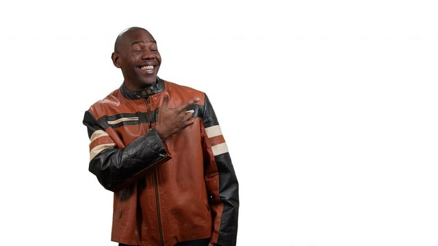African man dances then points to the right with room for copy on white background