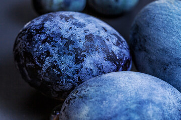 Painted easter egg shell with natural dyes in blue macro with soft focus