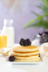 stack of pancakes with blackberries