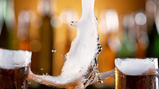 Super slow motion of beer glasses in cheers gesture. Filmed on high speed cinema camera, 1000 fps.