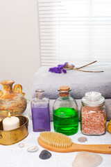 Obraz na płótnie Canvas set of spa accessories on the table by the window
