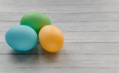 Easter eggs on a light wooden background